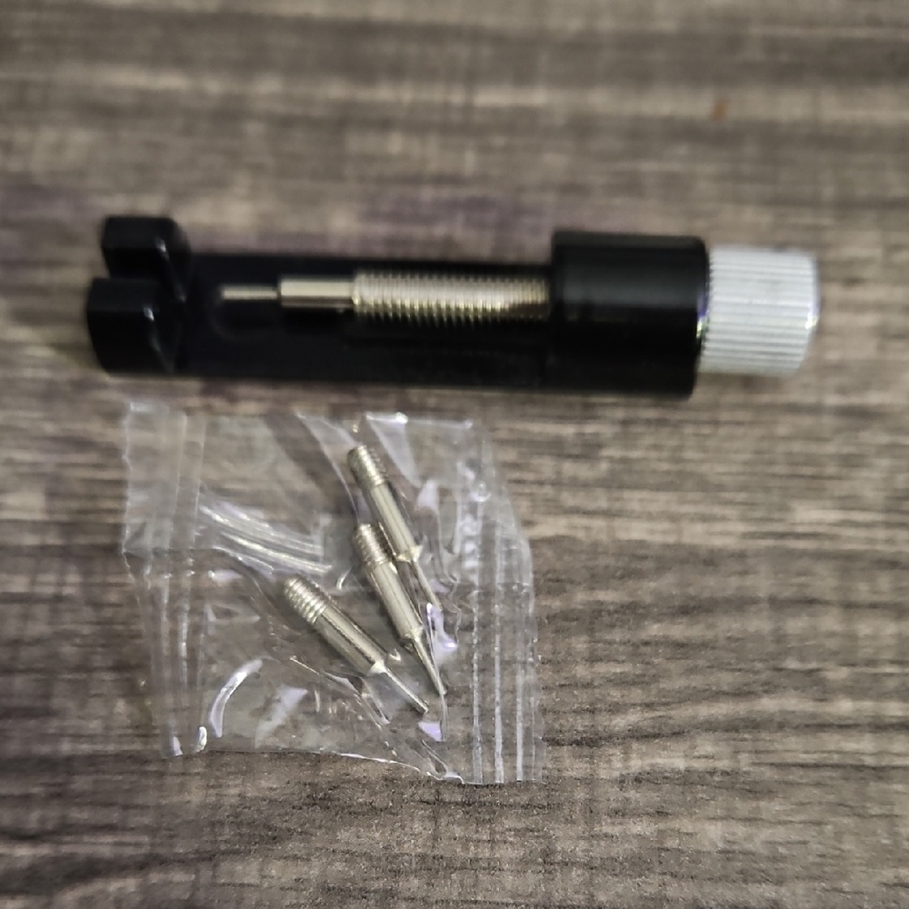 Black and Silver Watch Tool with Attachments
